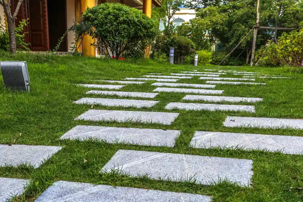 Modern garden patio paving with durable slabs and neatly landscaped surroundings